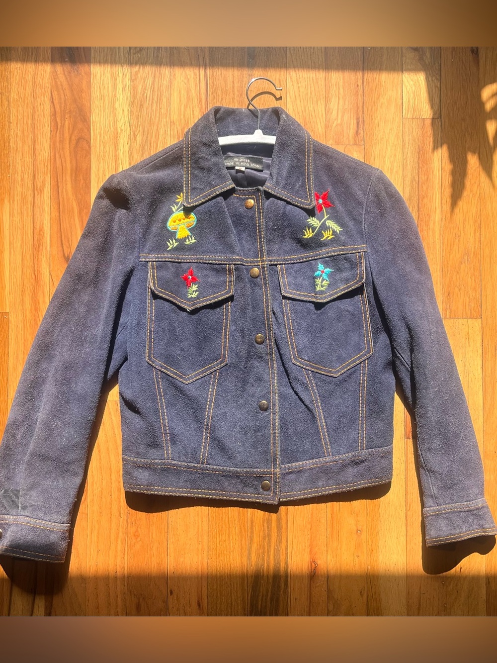 Blue leather jacket with embroidered details